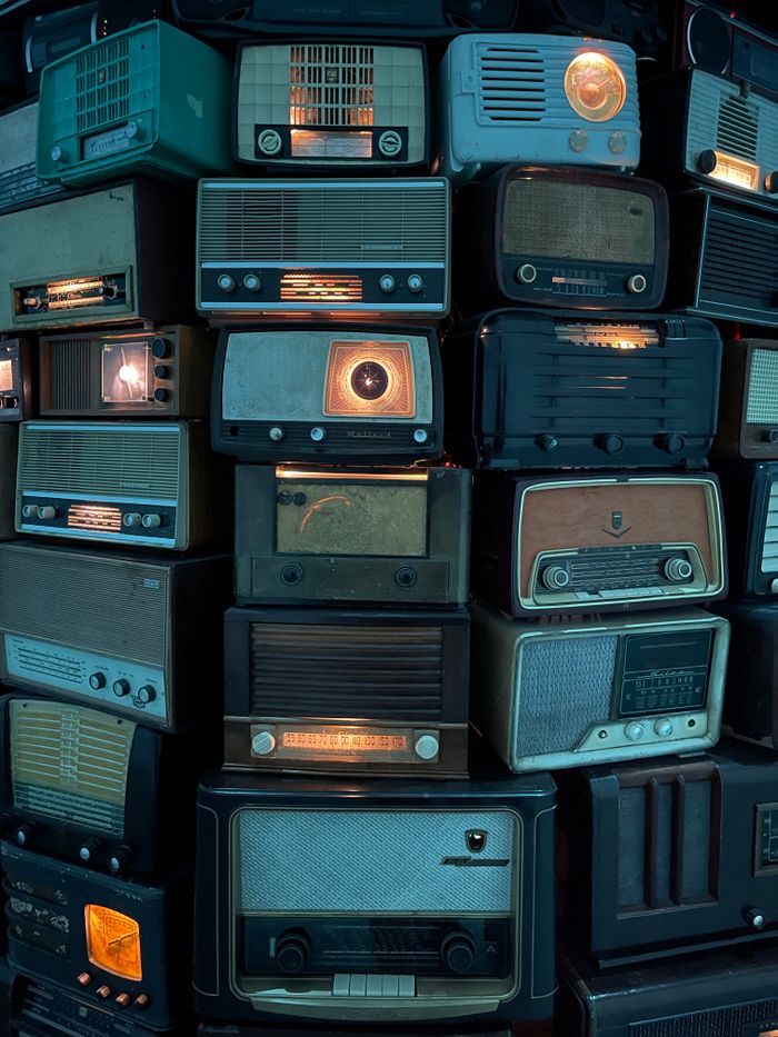 A nostalgic display showcasing various vintage radios, highlighting retro technology and design.