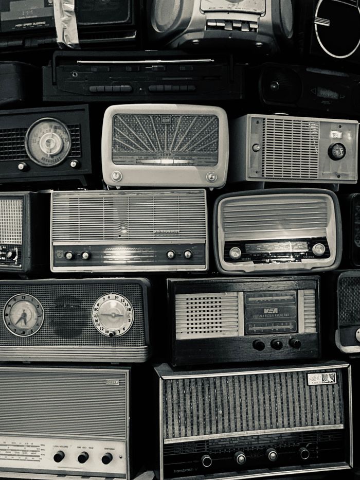 Aesthetic display of vintage radios, showcasing retro technology and design.